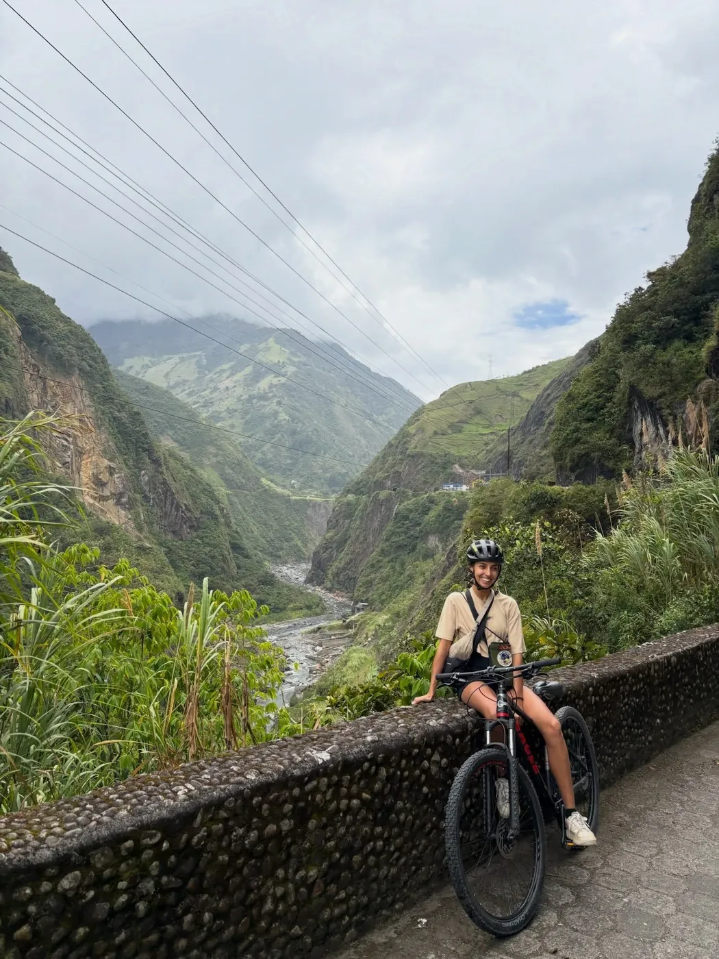 Natasha cycling a mountain road, Baños
