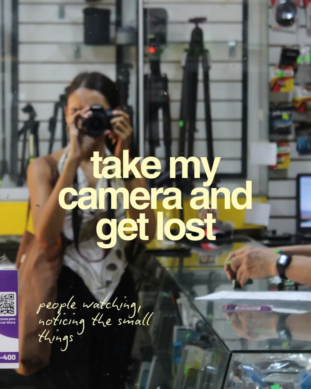 take my camera and get lost. Natasha with her camera in a shop
